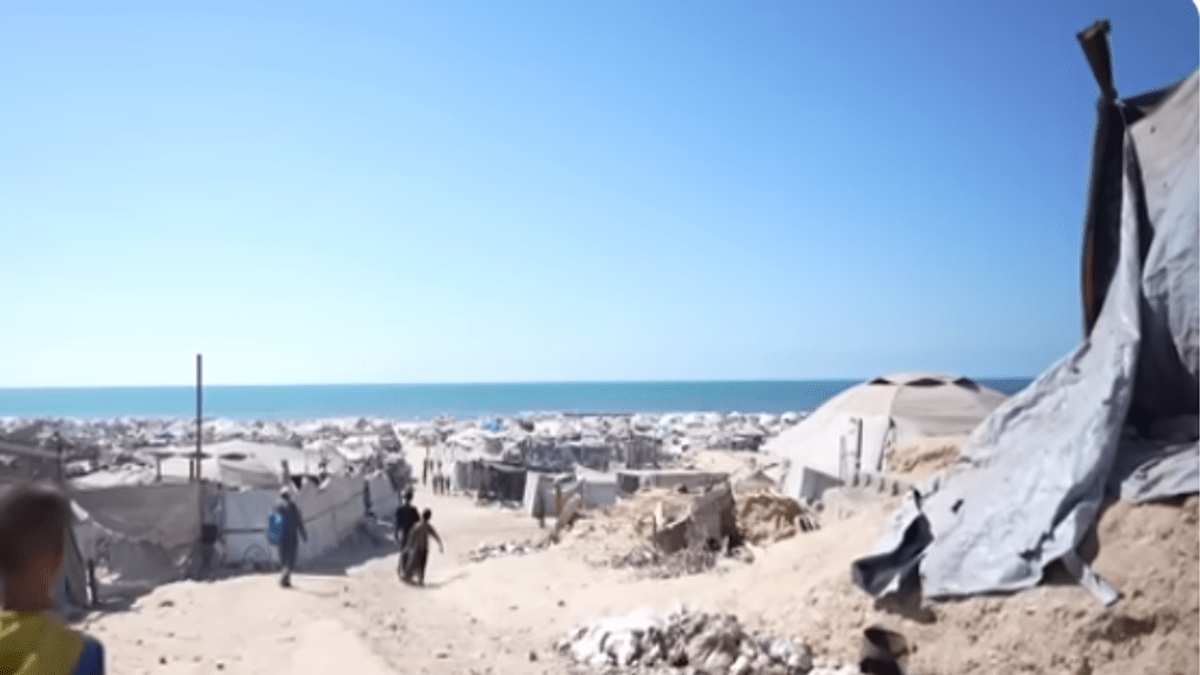 Tents spread out on a beach in Gaza